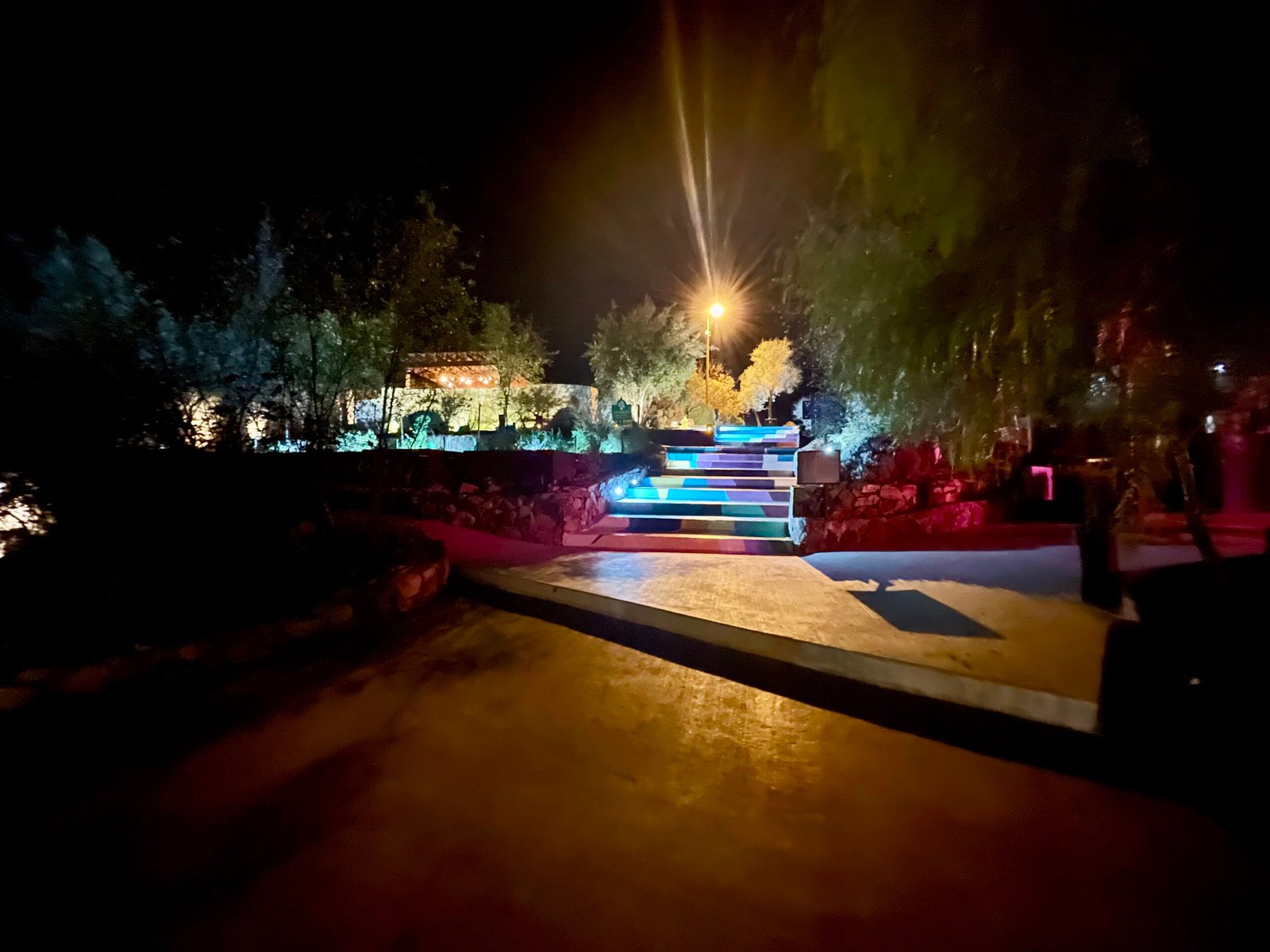 Multi-colored illuminated stairs at night at Maglen Resort, Valle de Guadalupe.